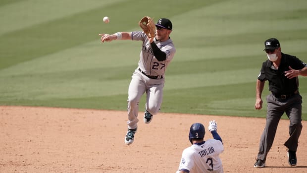Aug 23, 2020; Los Angeles, California, USA; Los Angeles Dodgers left fielder Chris Taylor (3) slides into second base to beat a throw to Colorado Rockies shortstop Trevor Story (27) for a stolen base in the seventh inning at Dodger Stadium. Mandatory Credit: Kirby Lee-USA TODAY Sports